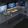 A gaming desk setup in a room with a computer, monitor, and accessories. Produktbild-Vorschau