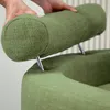 Hands adjusting a green headrest on a green chair. Produktbild-Vorschau
