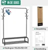 Collage showing a metal clothing rack, its packaging, and an instruction manual. Includes a "In De Doos" (In The Box) label and a "Nederlands Merk" (Dutch Brand) tag. Voir les images du produit