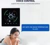 A woman is smiling while a smart thermostat is displayed on the wall with voice control instructions. Náhled obrázku produktu