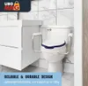 A toilet seat riser with armrests is shown attached to a toilet in a bathroom setting. Anteprima dell’immagine prodotto