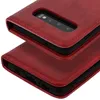Close-up view of a red flip cover wallet case for a Samsung Galaxy S10, showing the camera cutout and the stitching detail. Produktbild-Vorschau