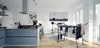 A modern kitchen with a drying rack full of laundry. Produktbild-Vorschau