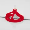 A red tile leveling system tool is shown on a white tiled surface with grout lines. Produktbild-Vorschau