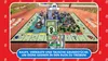 A Monopoly board game with 3D city buildings and money displayed on a wooden table, with a red border and text overlay. Produktbild-Vorschau