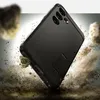 A black phone case is shown in a dynamic, action-oriented scene, appearing to be dropped or in motion, with dirt and rocks flying around it. Anteprima dell’immagine prodotto