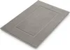 A single bath mat on a white background.