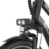 Close-up of the front of a black electric bicycle, focusing on the headlight and front fork. Produktbild-Vorschau