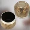 Two ceramic pots, one showing the inside and the other showing the bottom, are displayed against a blurred background. Produktbild-Vorschau