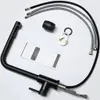 A black kitchen faucet and its accessories laid out on a white background. Produktbild-Vorschau