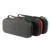 Three black carrying cases for a Nintendo Switch are lined up against a white background. The cases have colored zippers: red, blue, and another blue one. Each case has a black handle. Produktbild-Vorschau