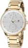 A close-up studio shot of a gold Tommy Hilfiger watch against a white background. Produktbild-Vorschau