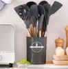 A set of kitchen utensils in a holder on a countertop next to a toaster. Náhľad obrázku produktu