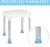 A white shower stool with silver legs and blue rubber feet, shown on a white background. A close-up inset highlights the rubber feet. Produktbild-Vorschau