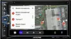 A car navigation system displaying a map of Munich International Airport with destination options. Produktbild-Vorschau