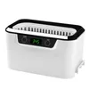 A white ultrasonic cleaner with a black rim and a digital display. Náhled obrázku produktu