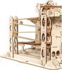 A close-up view of a wooden marble run construction kit with marbles on the tracks. Voir les images du produit