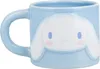 A light blue ceramic mug with a raised Cinnamoroll character face design. Podgląd zdjęcia produktu