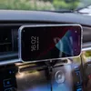 A smartphone is mounted on a car dashboard, connected to a charger. Náhled obrázku produktu