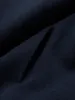A close-up view of dark blue fabric, showing the texture and a seam or fold. Anteprima dell’immagine prodotto