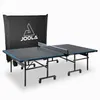 A JOOLA outdoor table tennis table with a protective cover behind it, presented on a white background. Produktbild-Vorschau