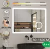 A modern bathroom with a large illuminated mirror above a black sink. Produktbild-Vorschau