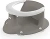 A gray baby bath seat with a white rim and clear suction cups on the bottom, shown on a white background. Produktbild-Vorschau
