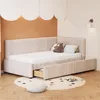A child's bedroom with a beige upholstered bed and a round rug. Anteprima dell’immagine prodotto