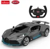 A remote-controlled Bugatti Divo car and its steering wheel controller are displayed against a white background. Produktbild-Vorschau