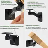 A collage of four images showcasing a black handrail bracket and its features, with a hand demonstrating its adjustability in one panel and a wooden handrail attached in another. Náhľad obrázku produktu