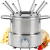 A stainless steel electric fondue set with a knob on the base, surrounded by cheese, bread, and strawberries. Voir les images du produit