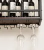 A close-up view of a wine rack mounted on a wall, showing wine bottles on the top shelf and wine glasses hanging from the bottom shelf. Náhľad obrázku produktu