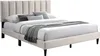 A beige upholstered bed frame with a channel-tufted headboard, shown with pillows and a throw blanket. Náhľad obrázku produktu