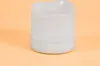 A close-up of a white LED candle on a light orange background. Produktbild-Vorschau