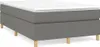 A studio shot of a dark gray box spring bed frame with a white mattress on top, supported by four light wood legs. Náhled obrázku produktu