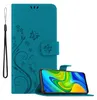 A teal flip phone case with a floral and butterfly design is shown open, with a smartphone displaying a colorful screen inside. A black wrist strap is attached to the left side of the case. Náhled obrázku produktu