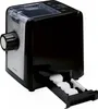 A black and silver pasta machine is shown from a slight angle, with a pull-out drawer containing white circular items. Produktbild-Vorschau