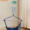 A baby swing motor unit is shown hanging above a blue hammock chair. Produktbild-Vorschau