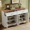 A white and wood grain sideboard with open doors and drawers, displaying various dishes and kitchenware. Anteprima dell’immagine prodotto