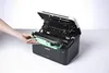 A hand is shown inserting a green toner cartridge into an open Brother laser printer. Náhľad obrázku produktu
