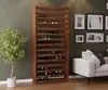 A wooden wine rack filled with wine bottles in a room with a sofa and framed pictures on the wall. Produktbild-Vorschau