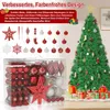 A Christmas tree decorated with ornaments and gifts at its base, with a display of various Christmas ornaments in the foreground. Voir les images du produit