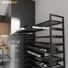 A modern kitchen with a built-in wine rack filled with bottles. Anteprima dell’immagine prodotto