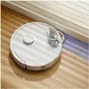 A white robotic vacuum cleaner is cleaning a wooden floor next to a white wall. Náhled obrázku produktu
