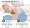 A child sleeping on a bed, with close-up insets showing mattress material and texture. Produktbild-Vorschau
