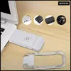 A white LED book light is clipped to a laptop, with several circular insets showing other electronic accessories. Náhľad obrázku produktu