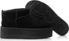 A pair of black platform UGG boots shown from a side angle, with one boot standing and the other lying on its side to show the sole. Voir les images du produit