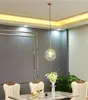 A dining room setting with chairs and a table, featuring a pendant light. Anteprima dell’immagine prodotto
