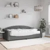 A dark gray daybed with a white mattress is shown in a room with shelves on the wall. Produktbild-Vorschau