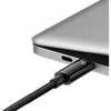A close-up shot of a black USB-C cable plugged into a silver laptop. Náhľad obrázku produktu
